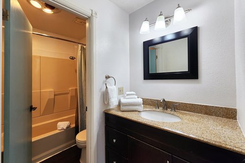 A full bath is shared by the two bedrooms on the main floor.