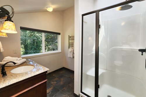 The ensuite bath upstairs with walk in shower.