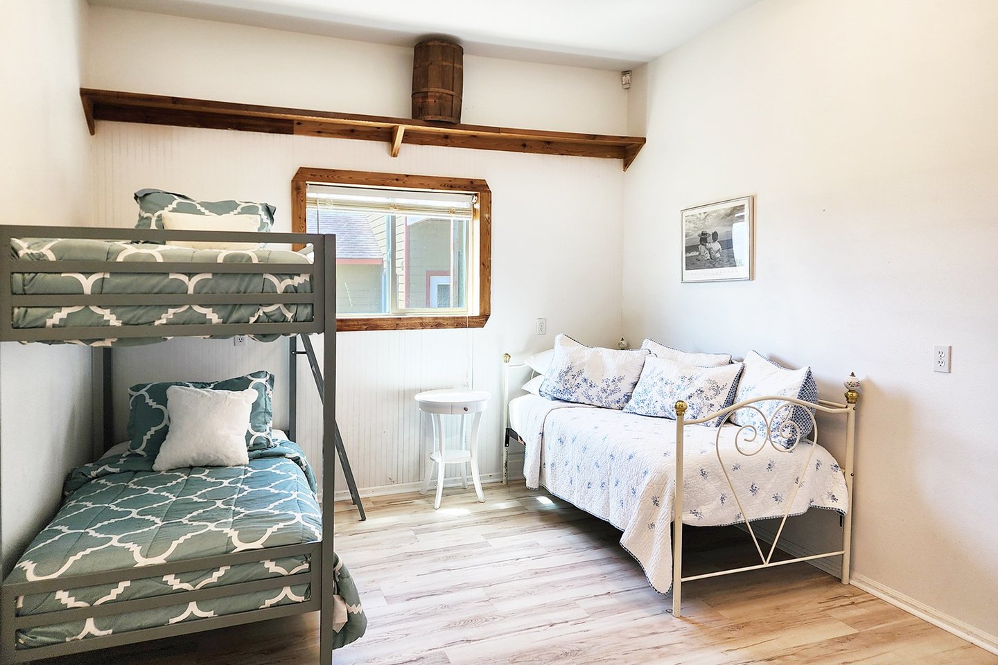 Entry level bedroom with bunk bed and day bed.