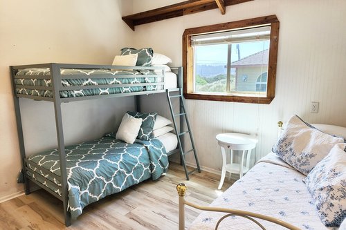 Entry level bedroom with bunk bed and day bed.
