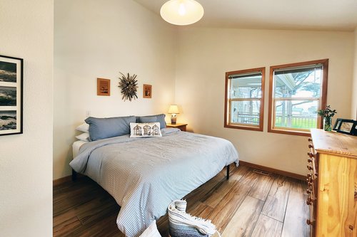 The primary suite is spacious and has a comfy king bed.