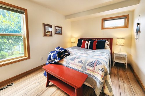Second bedroom in the house has a comfy queen bed.