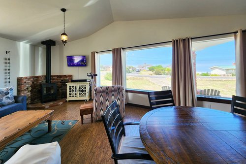 Open, bright and airy as well as cozy with the wood burning stove.