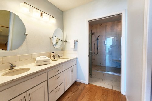 Large ensuite bath off of the primary bedroom with walk in shower.