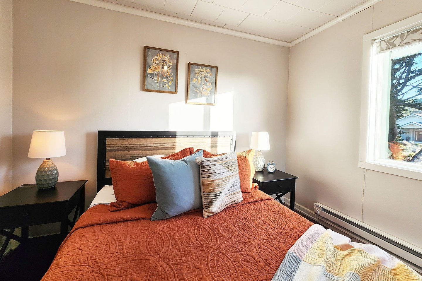 Cozy queen bed in the main floor bedroom.