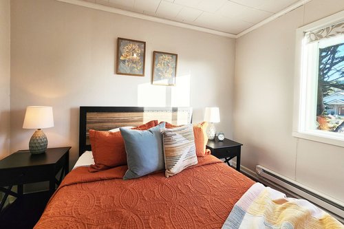 Cozy queen bed in the main floor bedroom.