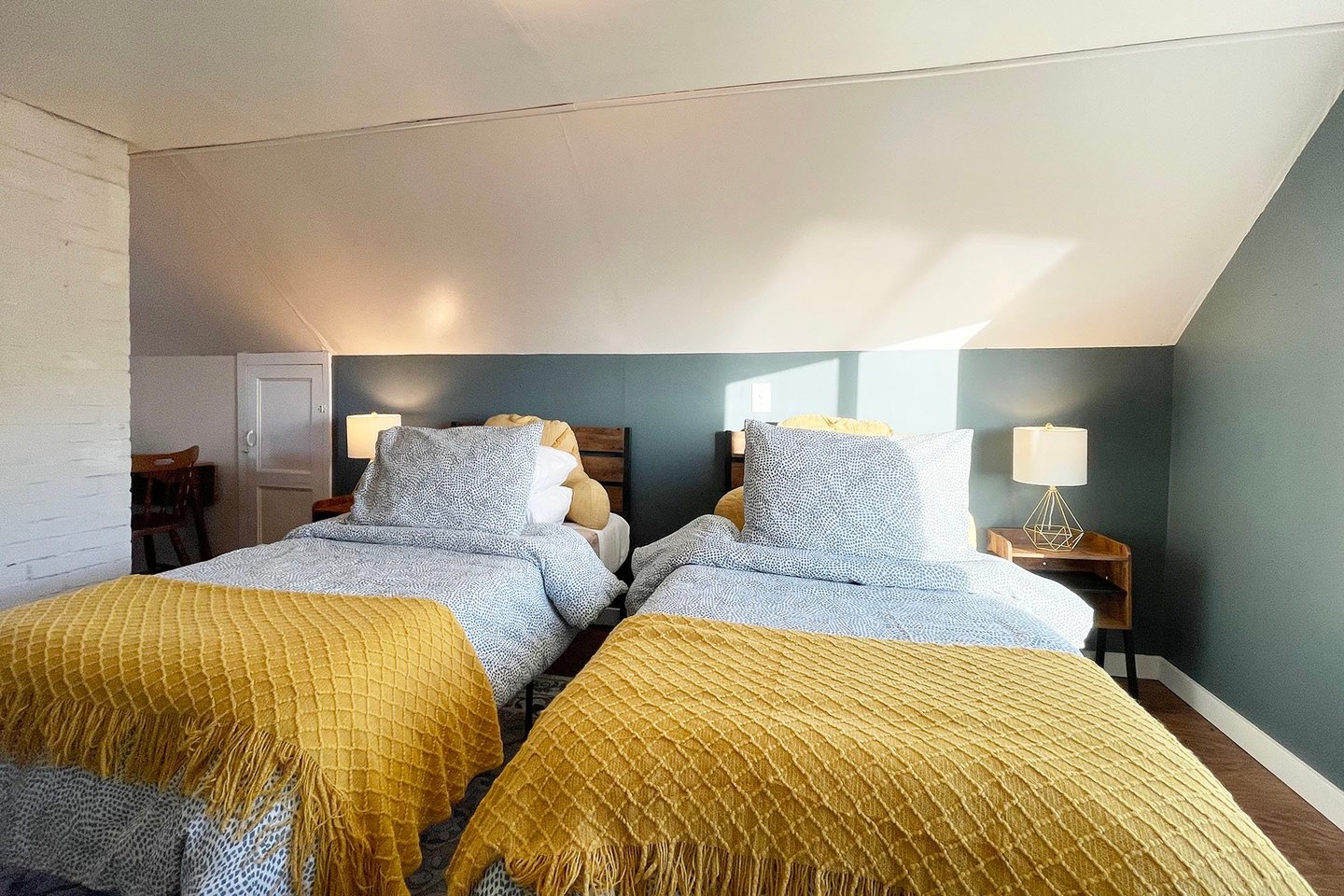 Up under the eaves you can find two twin beds!