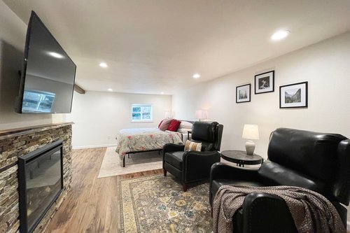 Downstairs is an entire bedroom suite with TV and electric fireplace.