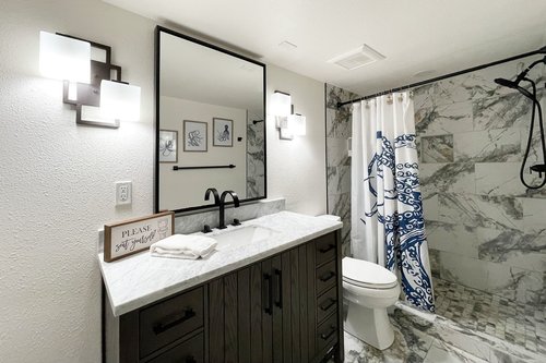 The downstairs suite has its own bath with walk in shower.