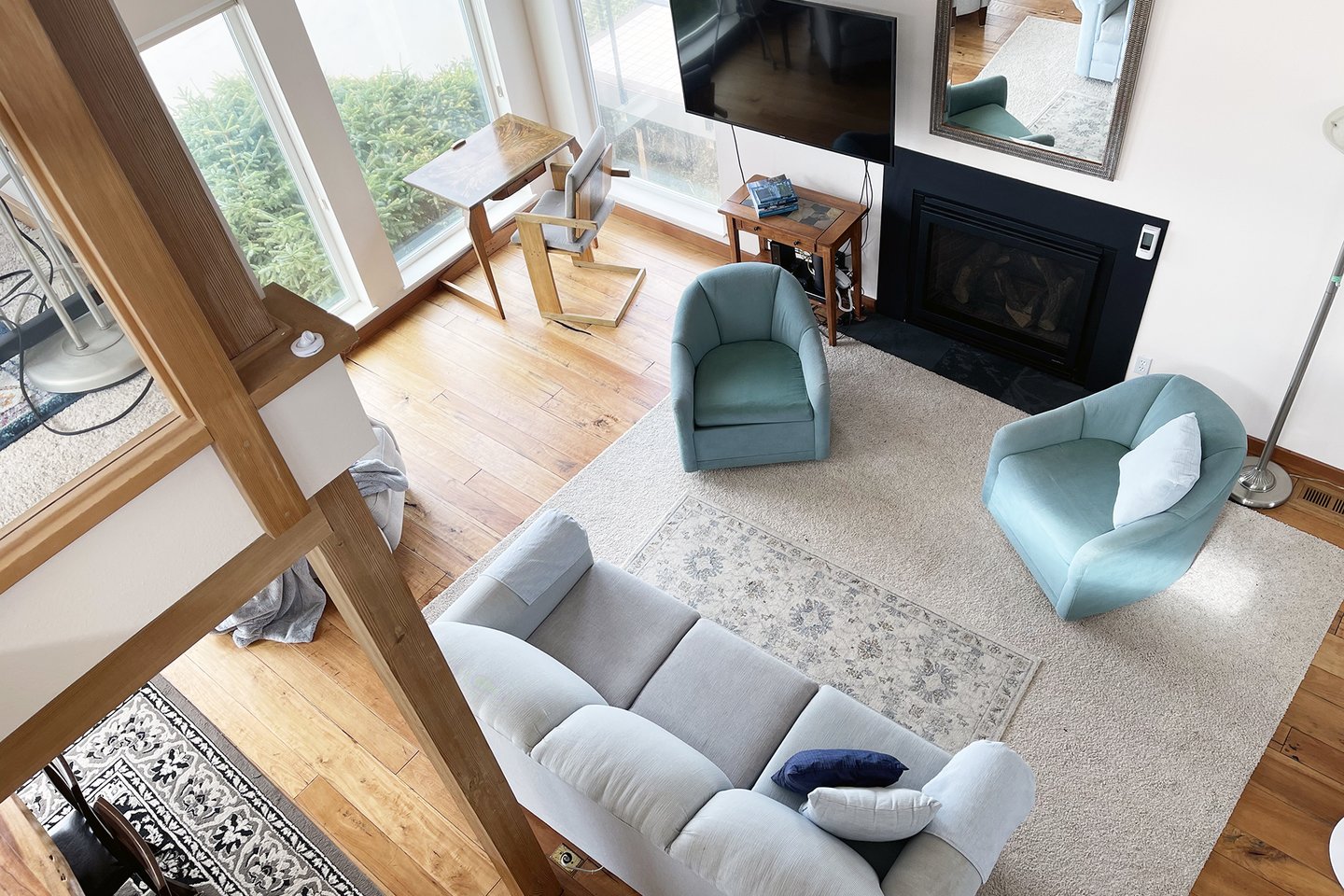Up above in the loft looking down in to the living room.