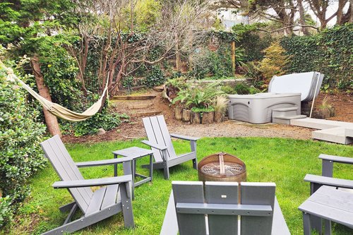 Relax and enjoy the hot tub, firepit and hammock!