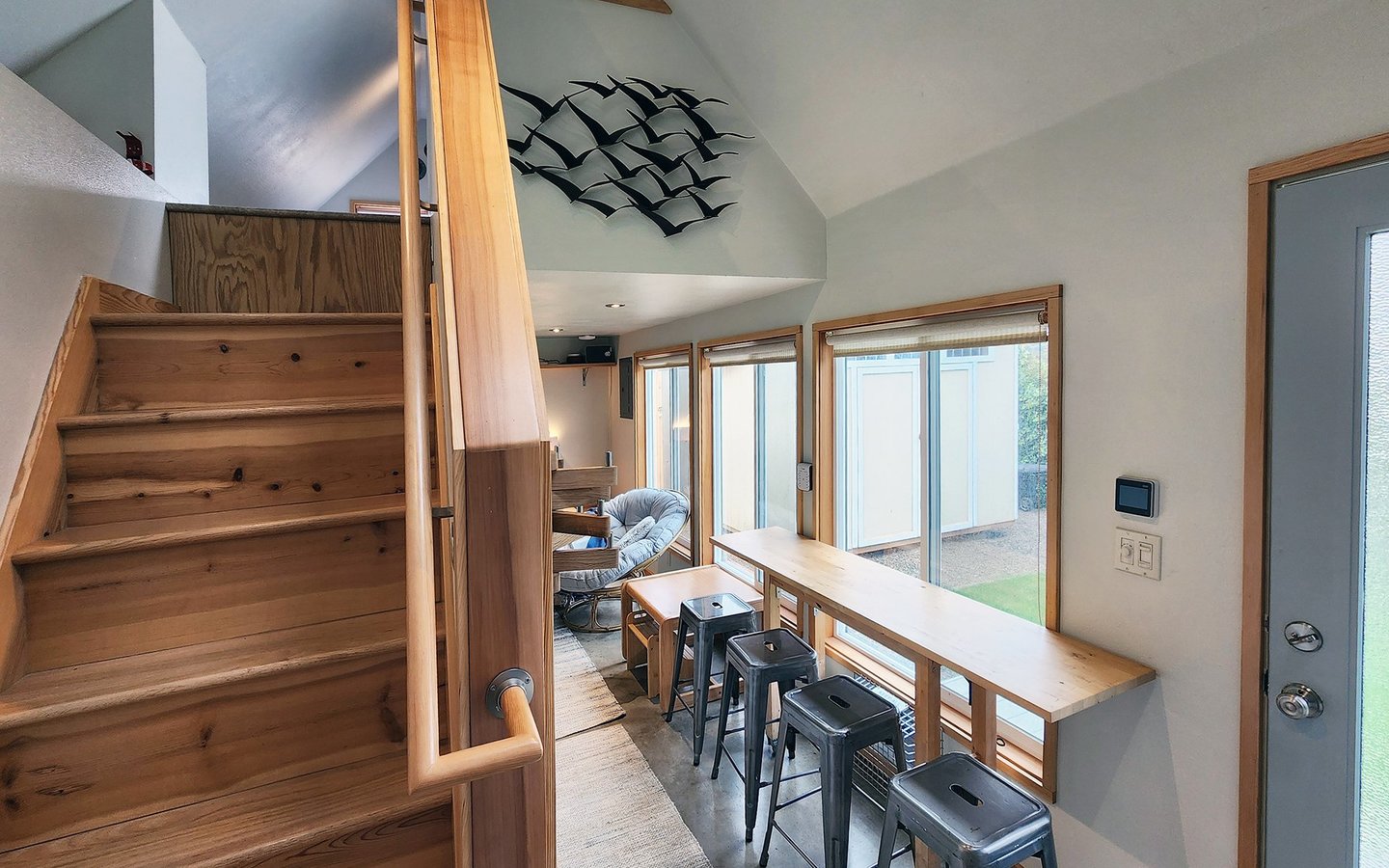 Stairs up to the loft cozy next to the dining nook.